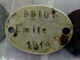 a metal tag that says brut emile on it