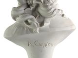 an image of a white bust of a woman with long hair
