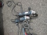 a corded drill and a corded cord on the ground