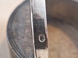 a small metal pan with a spoon sticking out of it