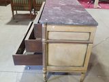 a kitchen island with a marble top and two drawers