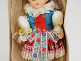 an image of a doll in a box on a white surface