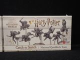 a box of miniature figurines of some sort on a table