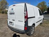 a white van that is parked on the side of the road
