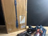 a box with a razor, a razor blade, and other items on a table
