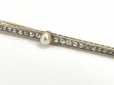 an image of a pearl and diamond hair clip on a white background
