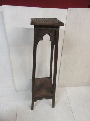 a small wooden table with a shelf on top of it