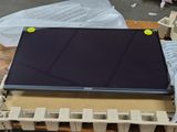 a laptop computer sitting on top of a box on a table