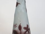 a glass vase with a bird on it on a white background