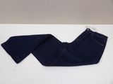 a pair of blue jeans sitting on top of a white table