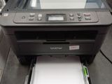 a printer that is sitting on top of a desk