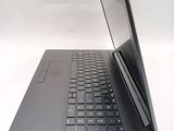 a laptop that is open on a white surface