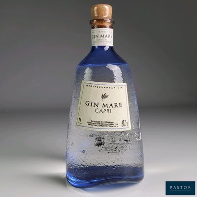 a bottle of gin mare capri sitting on a table