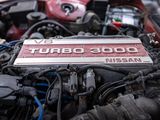 a picture of a car engine with its hood open