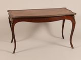 an old wooden table with a marble top on a white background