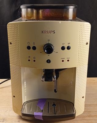 a coffee machine that is sitting on a wooden table
