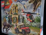 the box is open to show the contents of the lego jurassic set