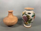 two vases sitting next to each other on a table