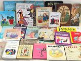 many children ' s books on the table together