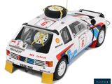 a model of a rally car on display on a white background