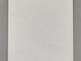 a white notebook with writing on it sitting on top of a table