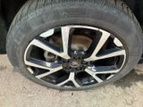the tire of a car with a flat tire on the ground