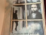a book with a picture of a man looking out of a window