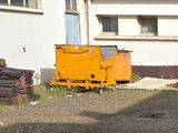 a dump truck that is parked in front of a building
