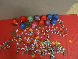 a red table with a bunch of toys on it