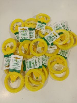 a pile of yellow rubber rings on a white table