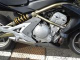 a close up of a motorcycle parked on the side of the road