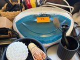 a table with a bowl of soap, a bowl of soap, a bowl of soap, a bowl of soap, a bowl of soap, and a