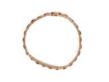 bracelet en or orné de pierres multicolores sur fond blanc