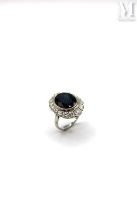 an image of a diamond and sapphire ring on a white background