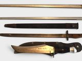 four different types of knives on a white surface