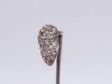 a close up of a diamond ring on a stick