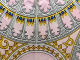 a picture of a pink and gold ceiling with a clock