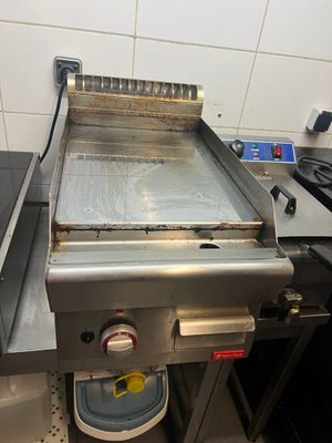 an image of a commercial grill in a commercial kitchen