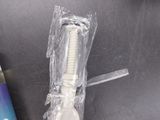 a bottle of toothpaste and a tooth brush on a table