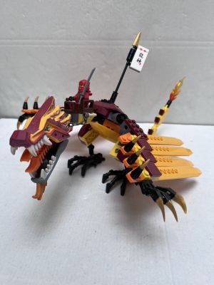 a toy dragon that is sitting on a table