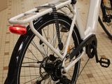 a bike that is parked in a room with many bikes
