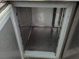 an image of a kitchen with a sink and a refrigerator
