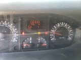 a close up of a dashboard with a clock on it
