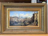 une peinture à l'huile représentant une vue d'une ville avec un pont