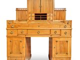 an image of a wooden desk with drawers and a cabinet