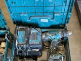 a blue box with tools in it on the floor