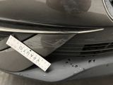 a sticker on the front of a car with a sticker attached to it