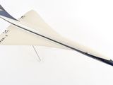 a model airplane that is flying in the air