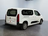 the white van is parked in the empty room of the building