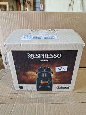a box of nespresso coffee sitting on a table